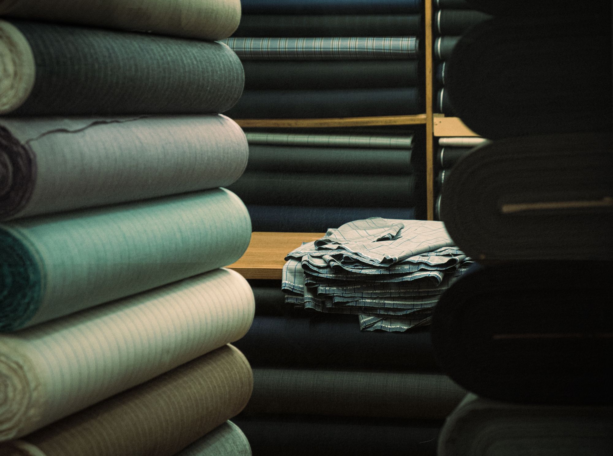 Textile rolls and prepared fabric pieces — reference photograph